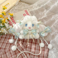 Lace Bow Bunny Plush Crossbody Bag: Blue bow bunny plush purse styled on plaid fabric beside flowers