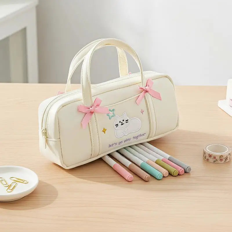 Bow Kitten Mini Tote Pencil Case: Beige kitten pencil case displayed with pens 04