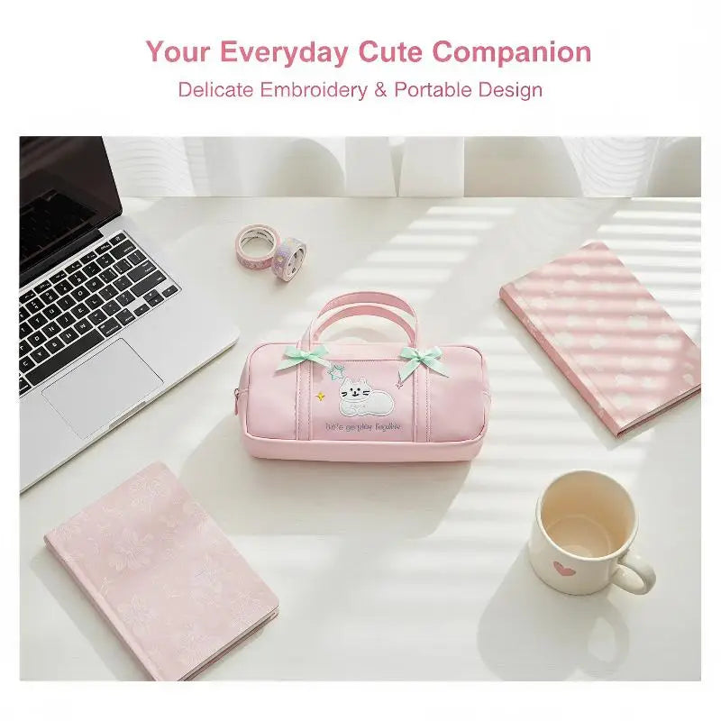 Bow Kitten Mini Tote Pencil Case: Pink kitten pencil case styled beside a laptop and mug 06