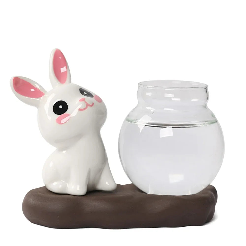 Bunny Glass Bud Vase: 02 sitting bunny beside an empty round glass bud vase