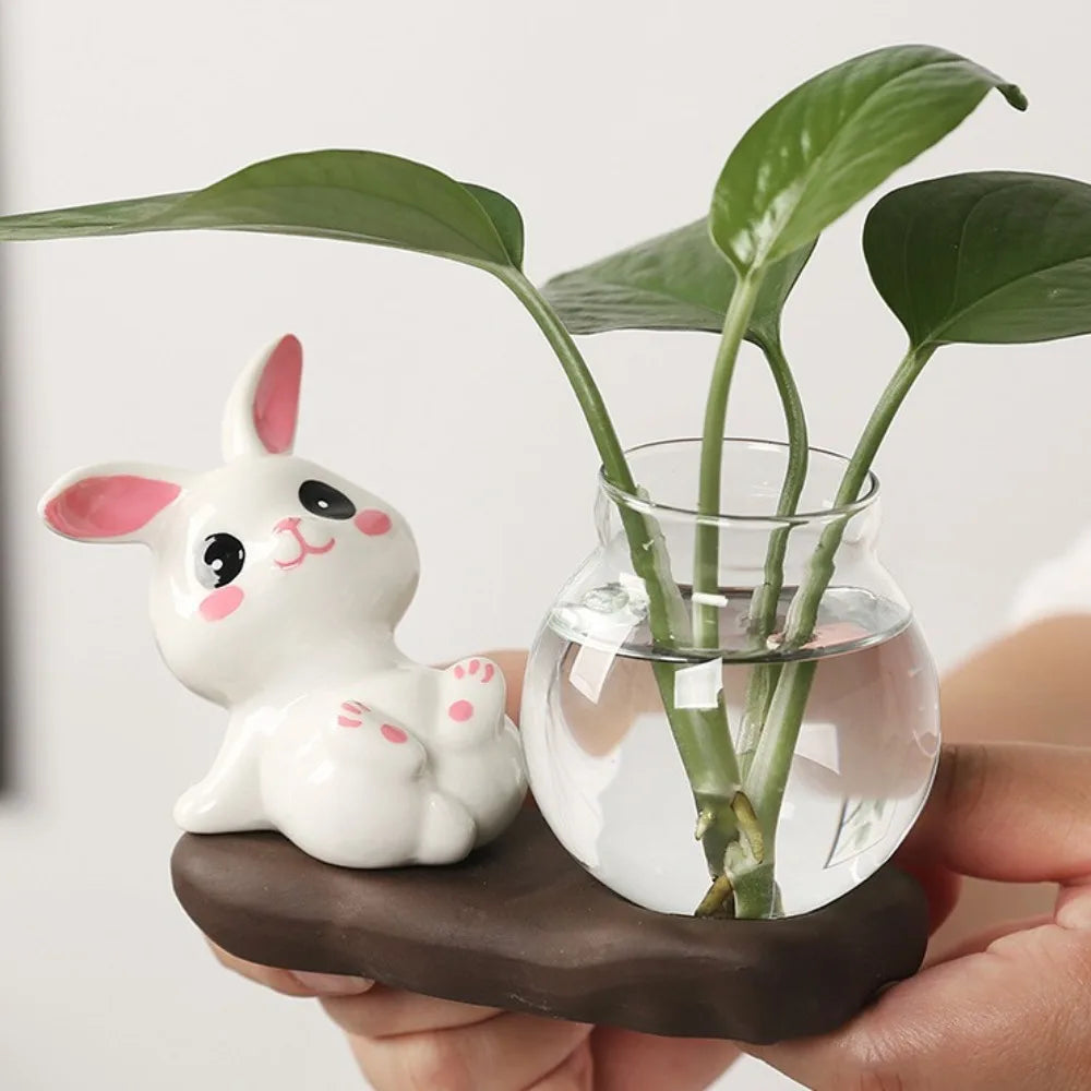 Bunny Glass Bud Vase: 04 close view of pink bunny paws beside leafy stems in