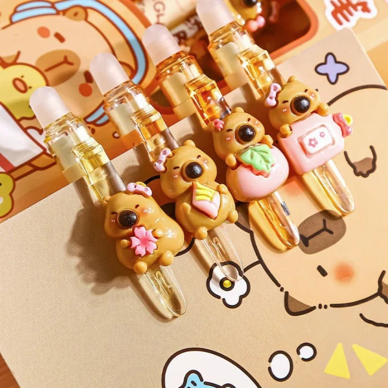 Capybara Erasable Gel Pen Set: 02 close up of the raised capybara decorations on brown gel pens