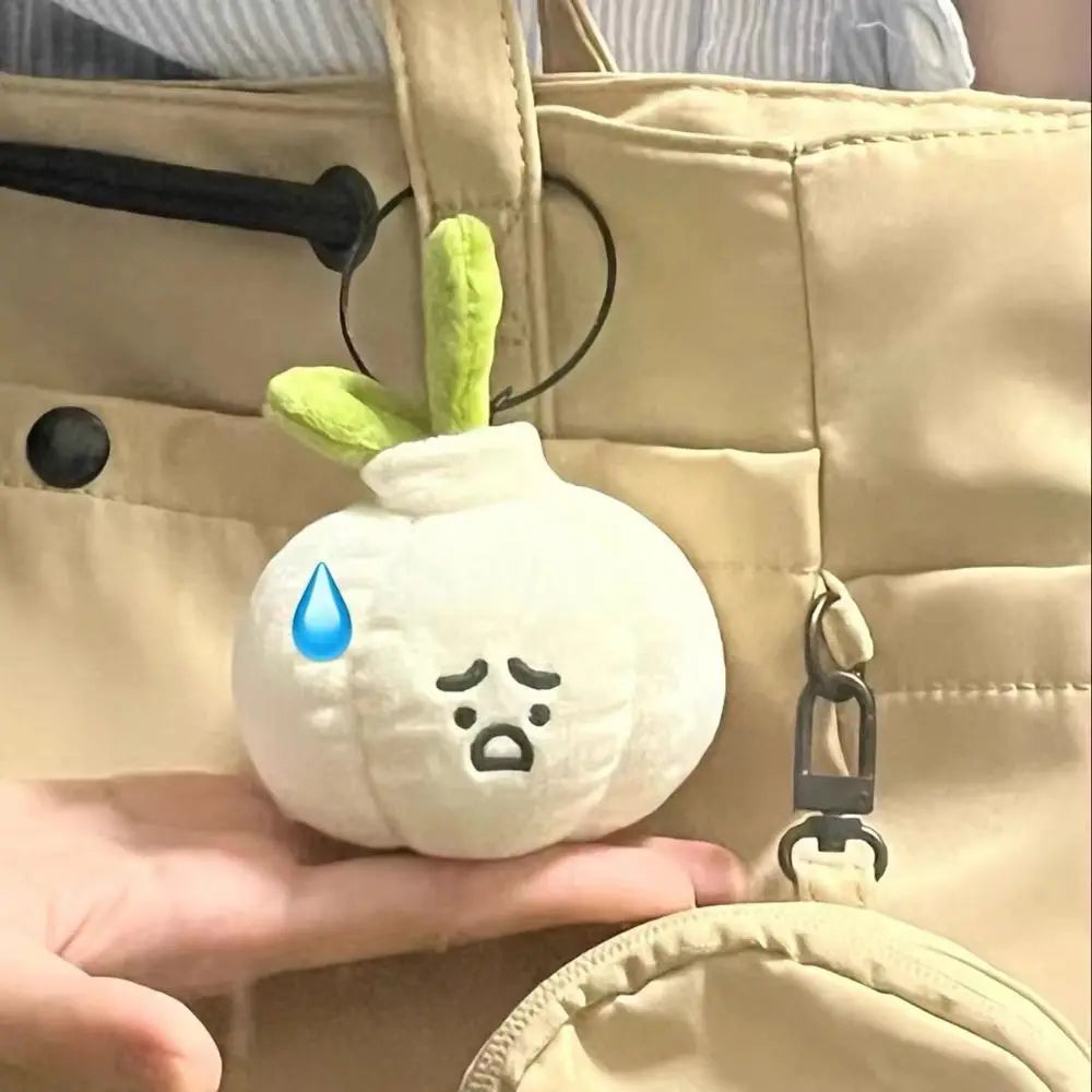 Grumpy Garlic Plush Keychain: Close view of the garlic charm and stitched face 05