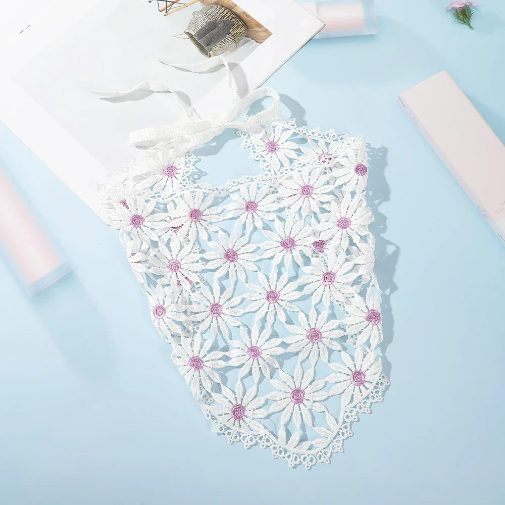 White daisy headscarf with purple centres and ribbon ties