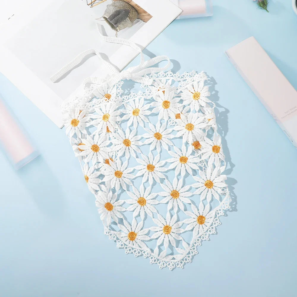 White daisy headscarf with yellow centres and ribbon ties