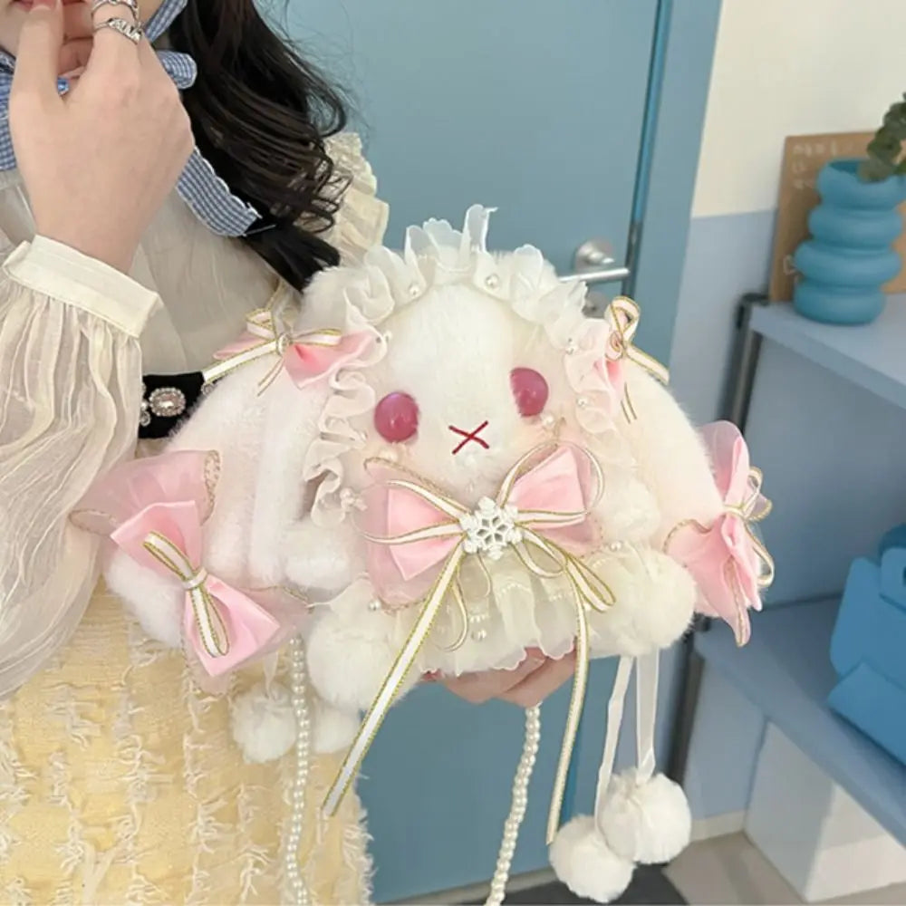 Lace Bow Bunny Plush Crossbody Bag: Pink lace bow bunny plush purse held close against a yellow dress