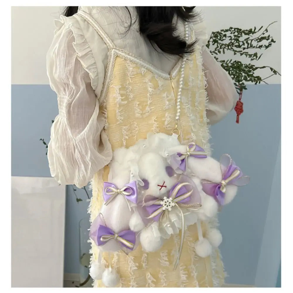 Lace Bow Bunny Plush Crossbody Bag: Purple bow bunny purse worn at the side of a yellow dress
