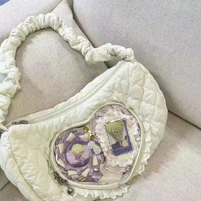 Quilted Heart Window Ita Hobo Bag: 04 beige quilted heart ita bag resting on a