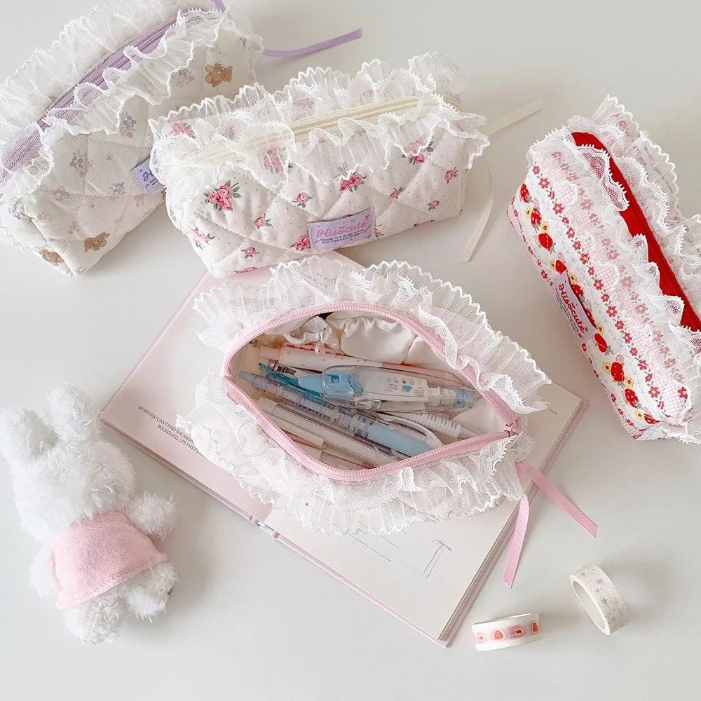 Quilted Ruffle Pencil Case: Open and closed ruffle pencil cases are arranged together on a white 18
