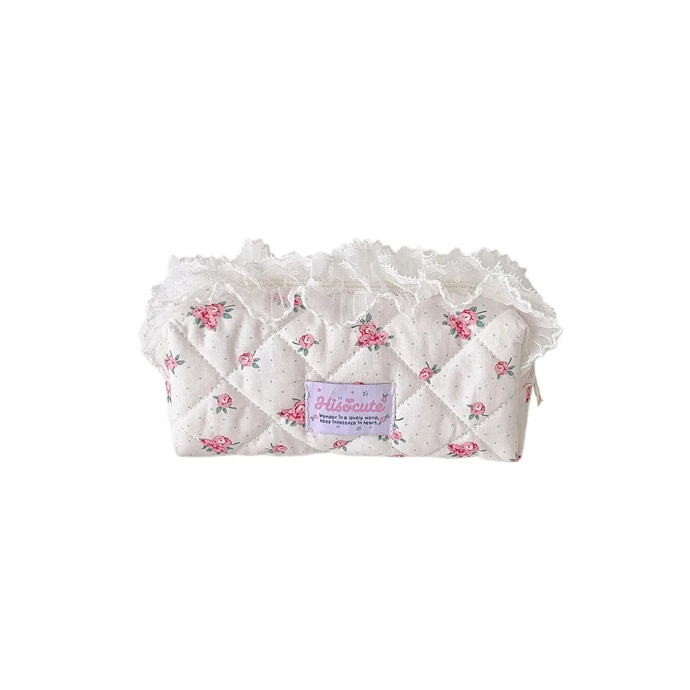 Quilted Ruffle Pencil Case: The pink floral pencil case is isolated on white showing rose motifs 21
