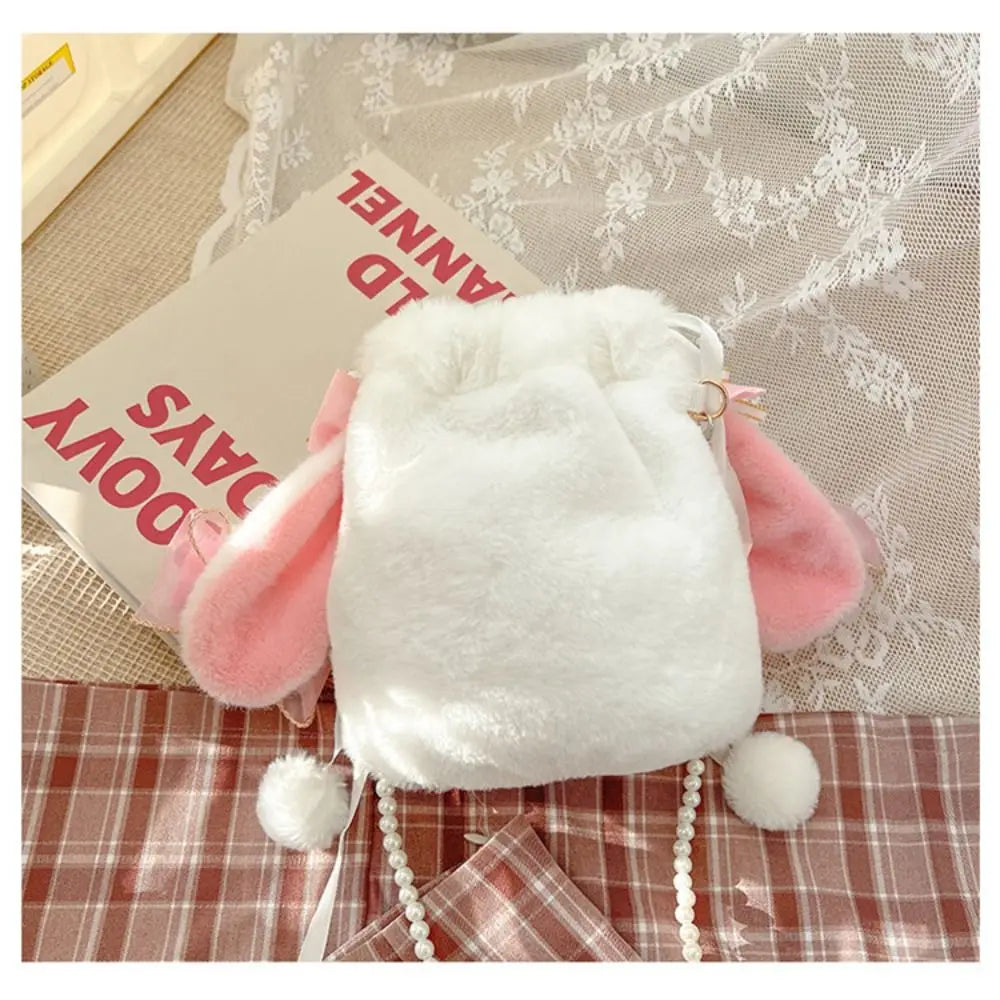 Lace Bow Bunny Plush Crossbody Bag: Rear of the white plush bunny purse with pink ears and beaded strap