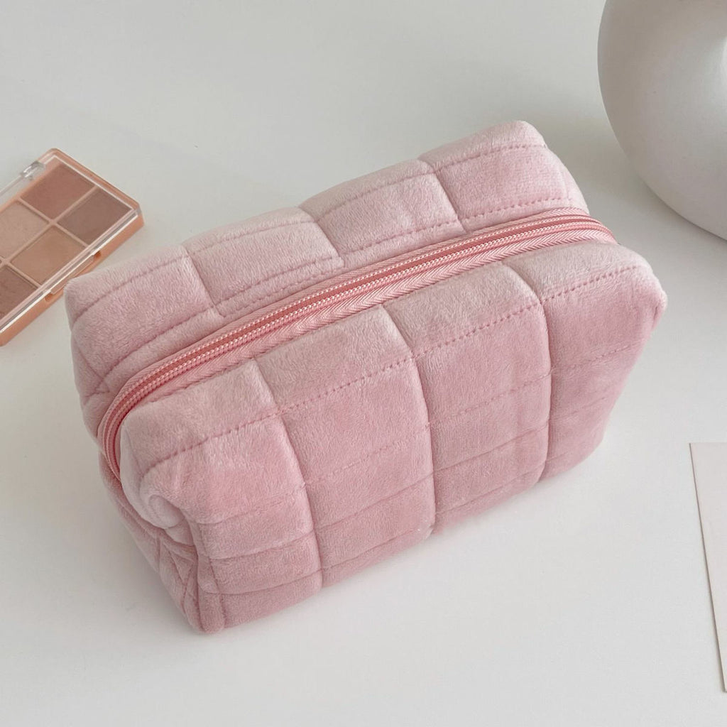 Pink quilted makeup bag with zip